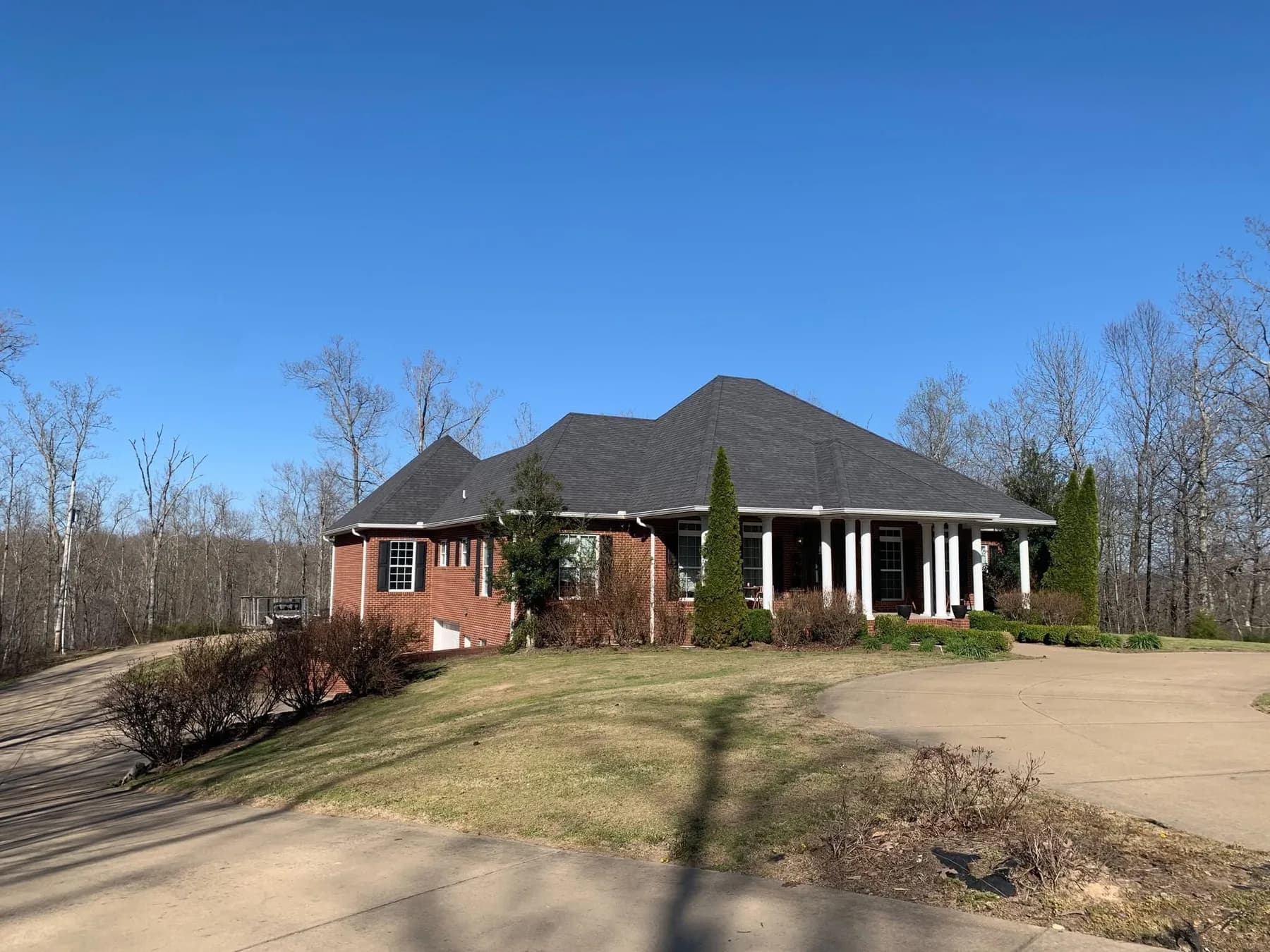 Brick home with completed black roof