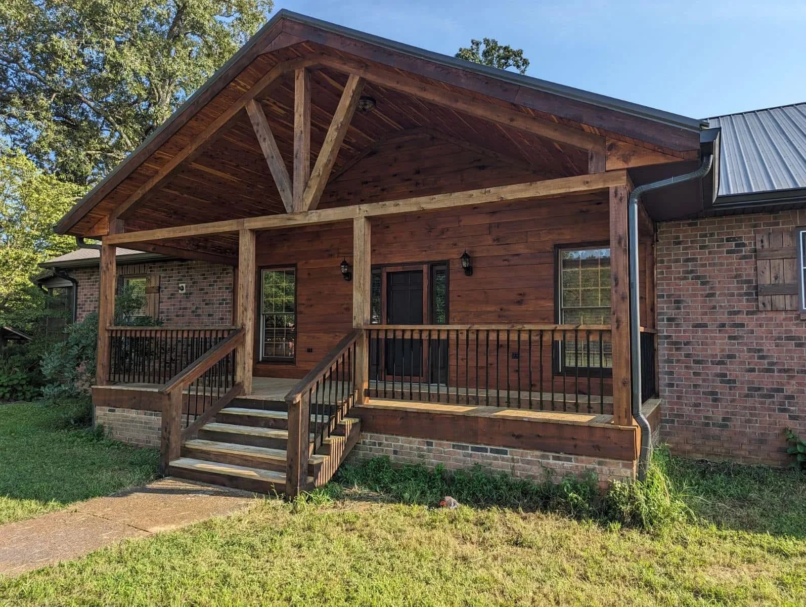 Cabin-style porch with metal roofing detail