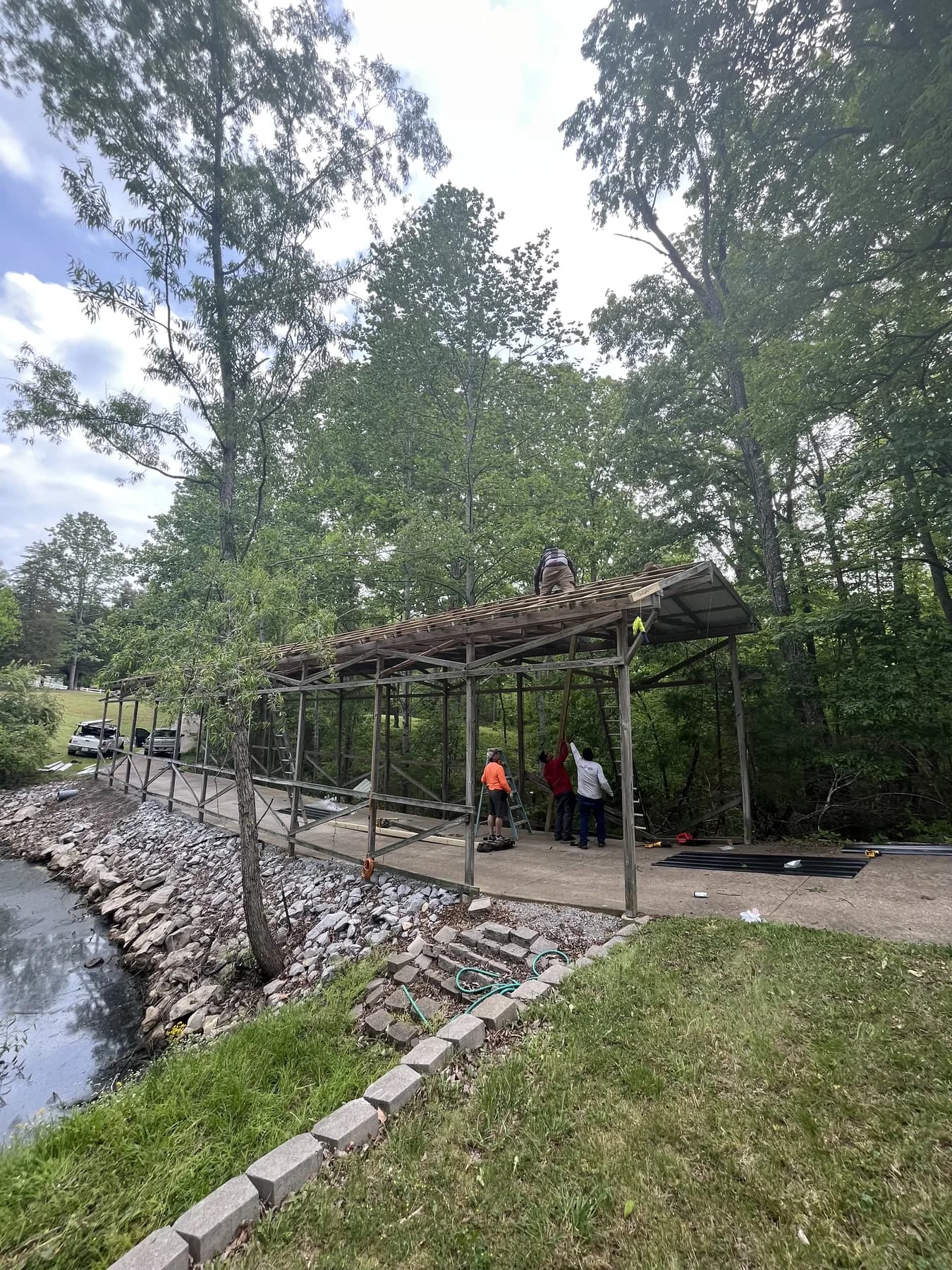 Wide view of covered porch roof framing
