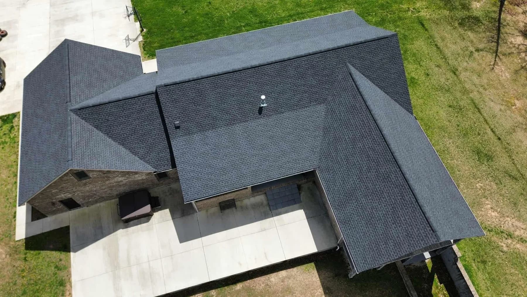 Aerial view of a gray shingle roof installation