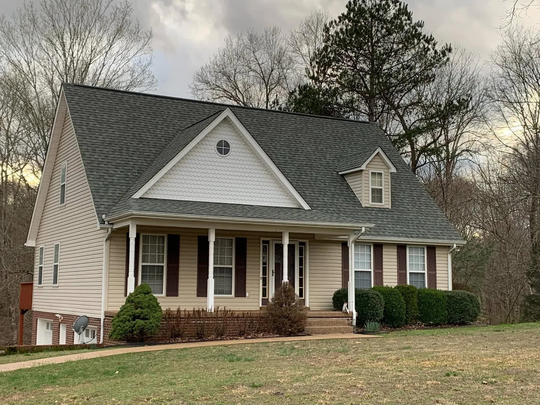 White home with finished gray shingle roof